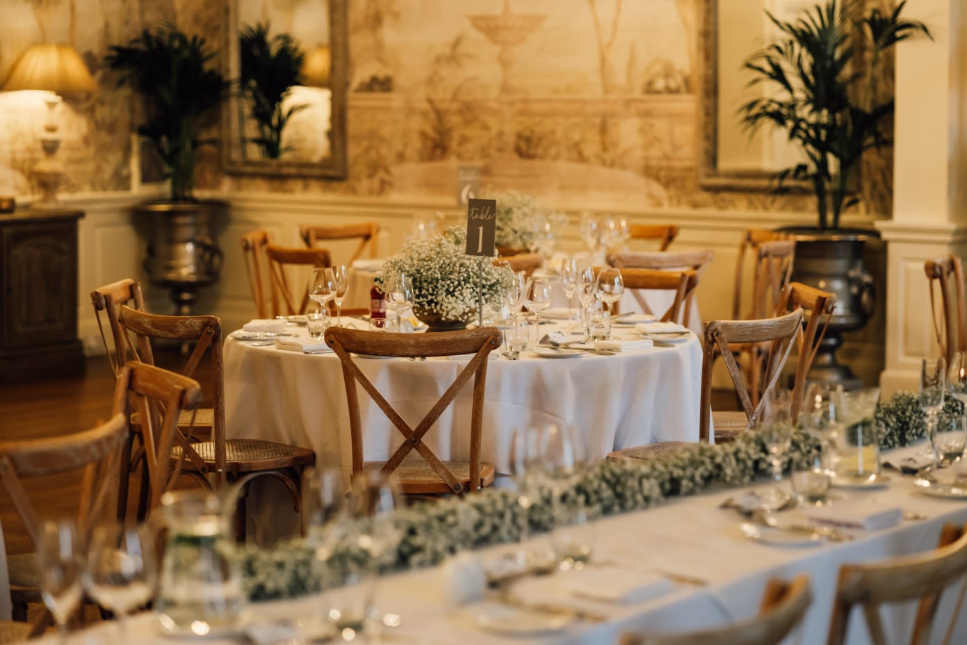 Wedding reception table layout with coordinated floral styling