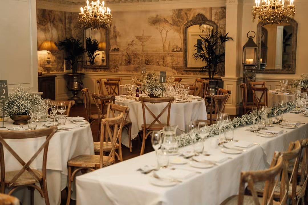 Wedding venue layout dressed with coordinated floral arrangements