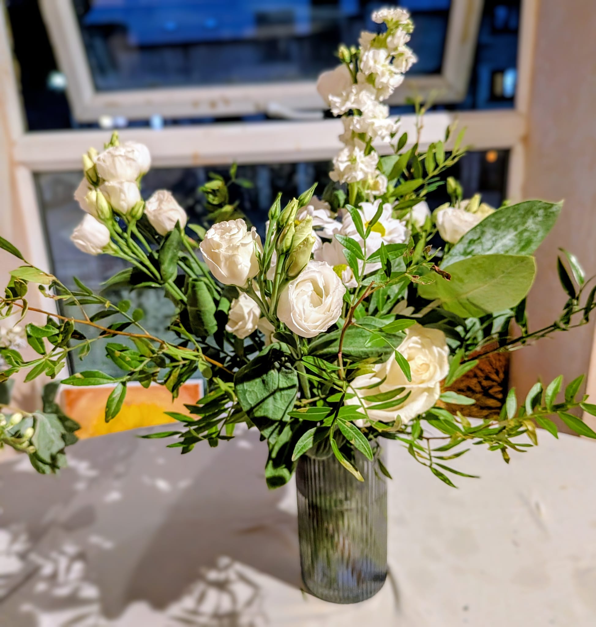 Tall white wedding centrepiece arrangement for reception tables